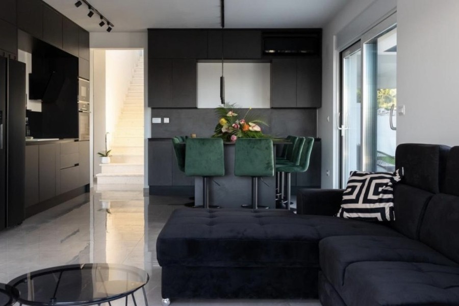 Living room with corner sofa and open kitchen