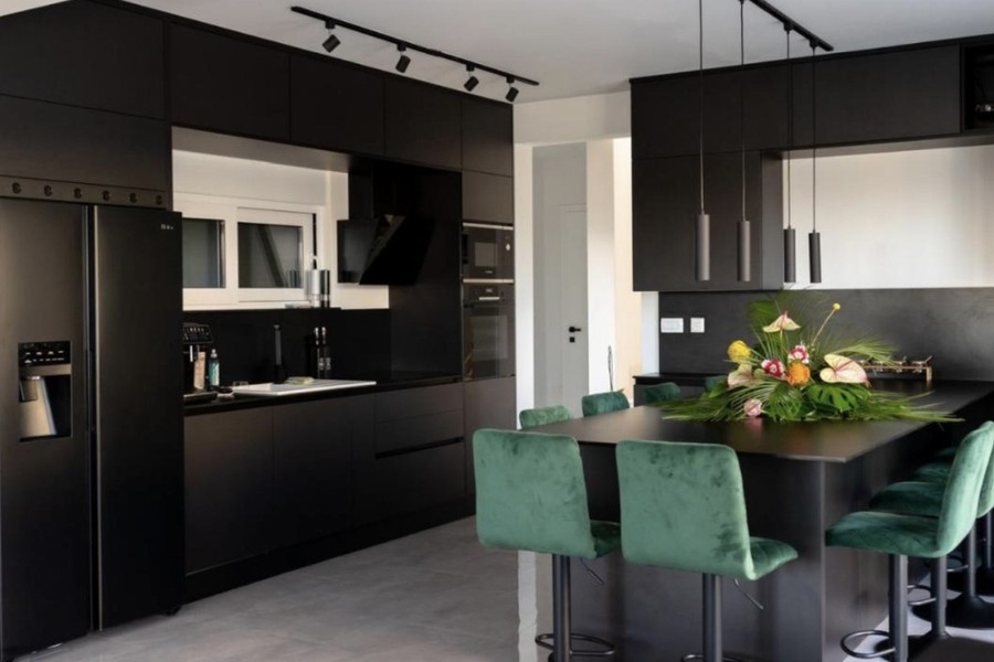 Modern kitchen with cooking island and bar stools