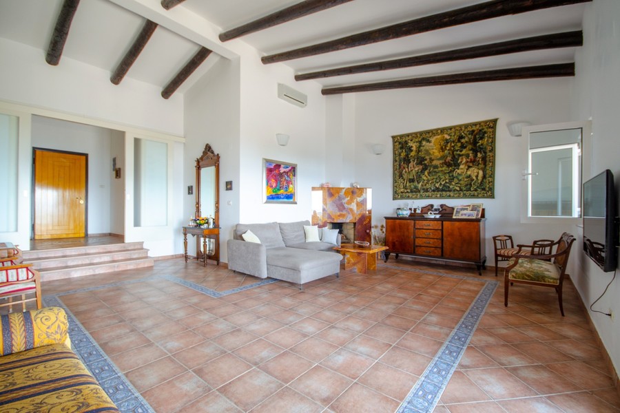 Living room with beamed ceiling and sofa