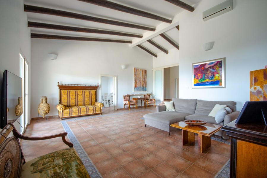 Living area with wooden beams and seating area