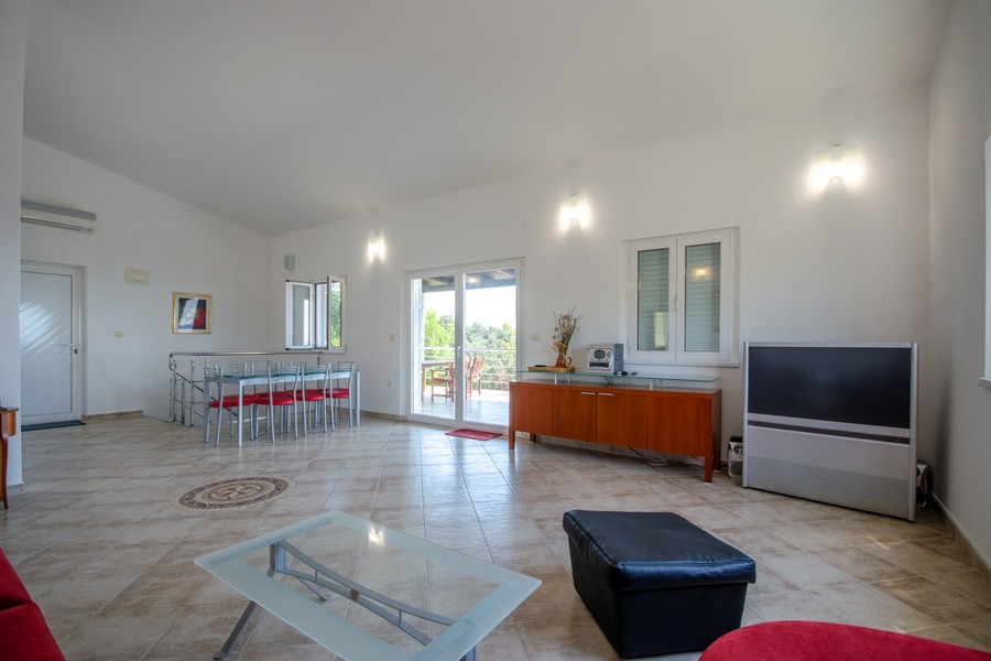 Living room with dining area in the second villa