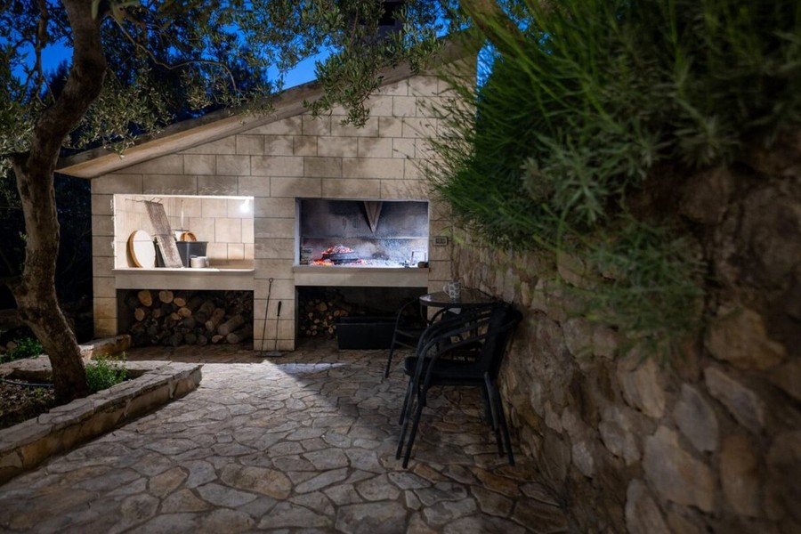 Covered barbecue area made of natural stone