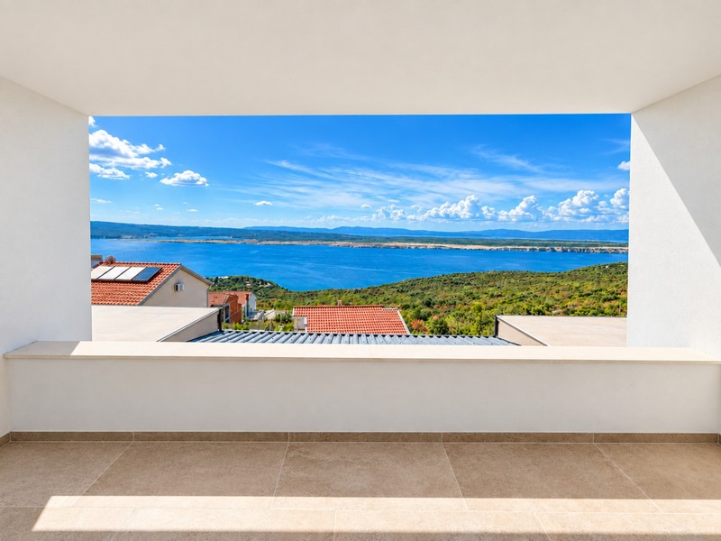 Sea view through a window opening on the upper floor