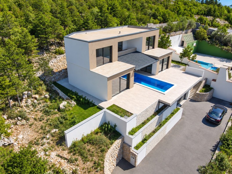 Aerial view of the villa with pool and driveway