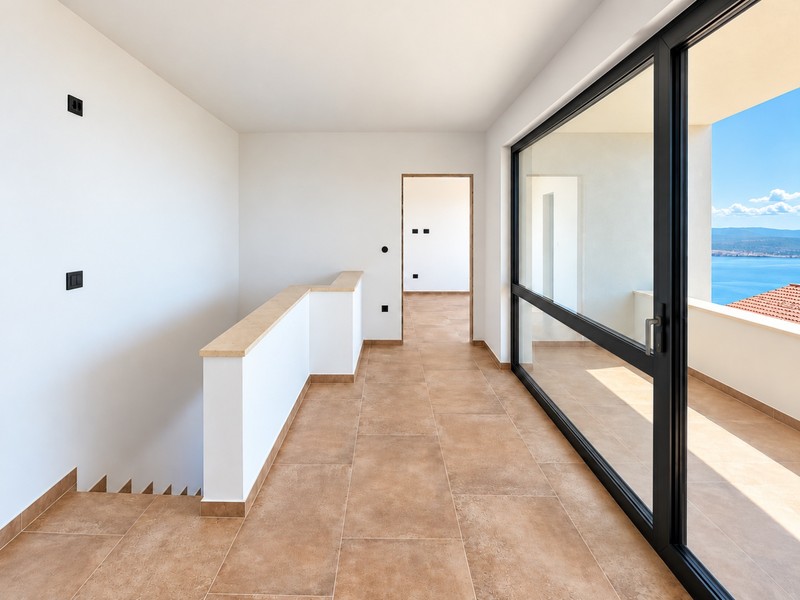 Room with stairs and large glass front