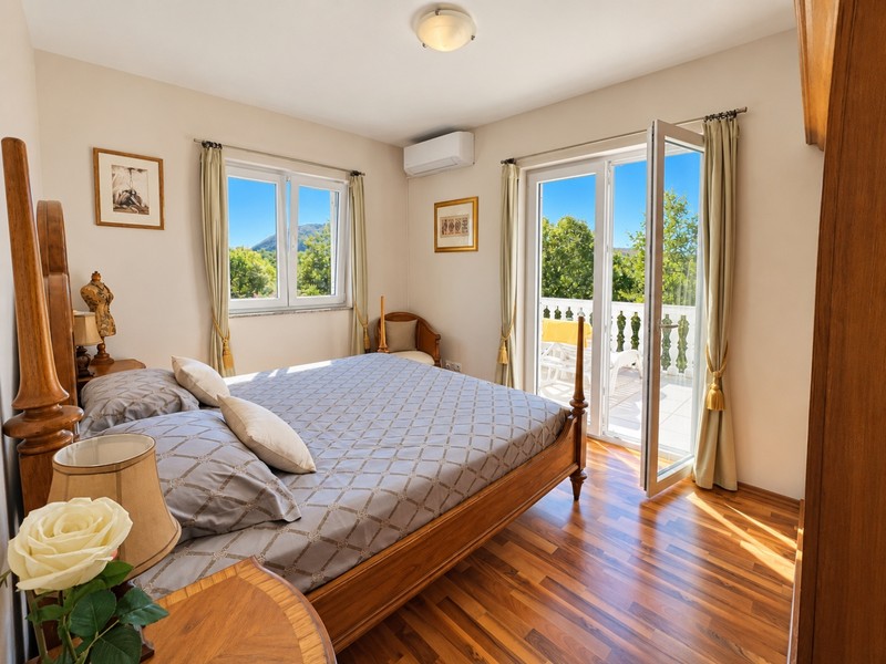 Bedroom with double bed and balcony door
