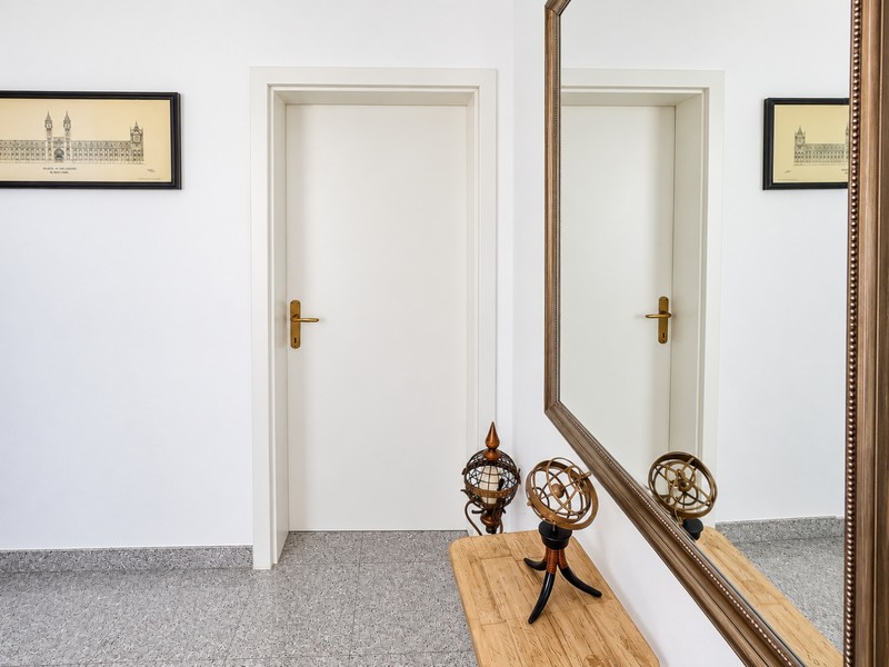 Hallway with large wall mirror