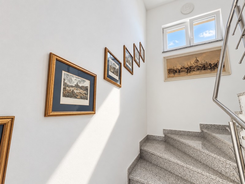 Staircase with pictures on the wall