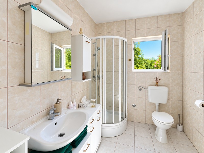 Bathroom with shower cubicle and window