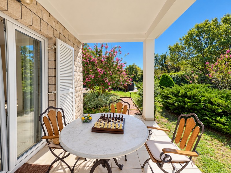 Terrace with dining table and view of the garden