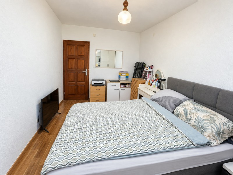Bedroom with double bed and television