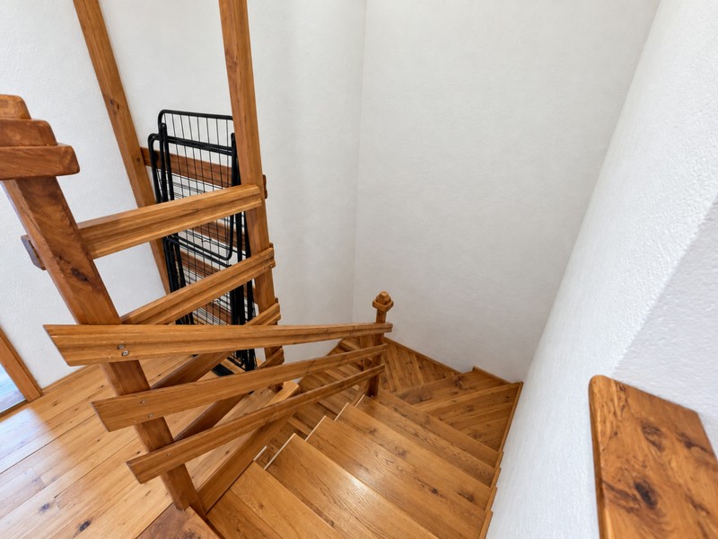 Wooden staircase to the attic floor