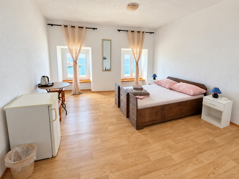 Bright bedroom with wooden floor