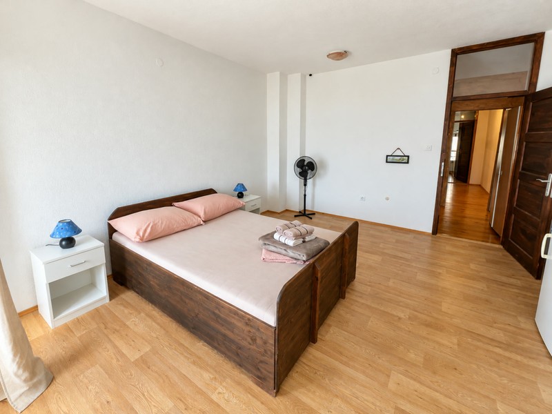 Bedroom with double bed and fan