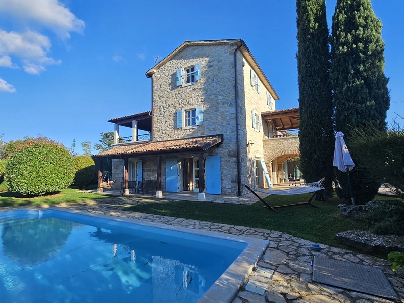 Stone house with pool, cypress trees and hammock