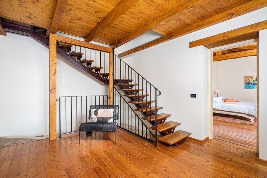 Staircase with wooden steps and floorboards