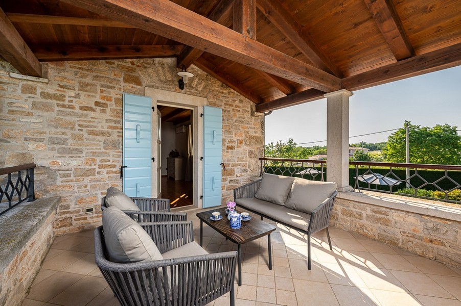 Upper terrace with sofa, armchairs and coffee table