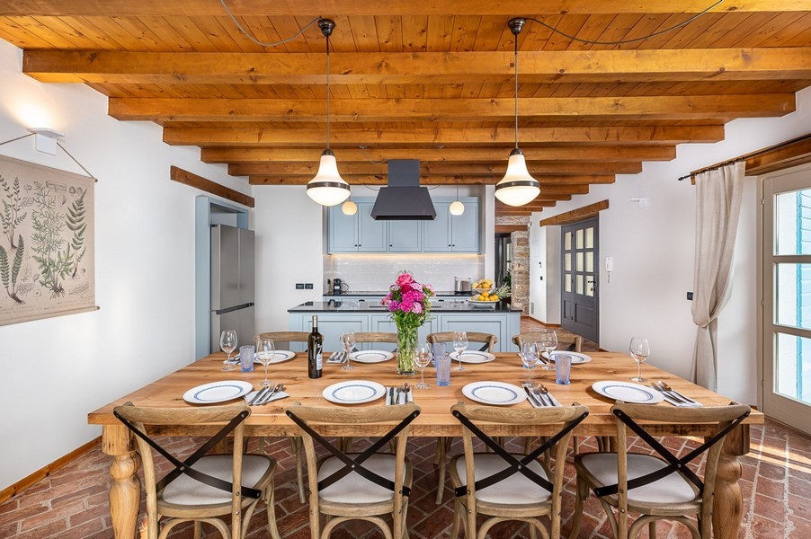 Set table in the kitchen with wooden beam ceiling