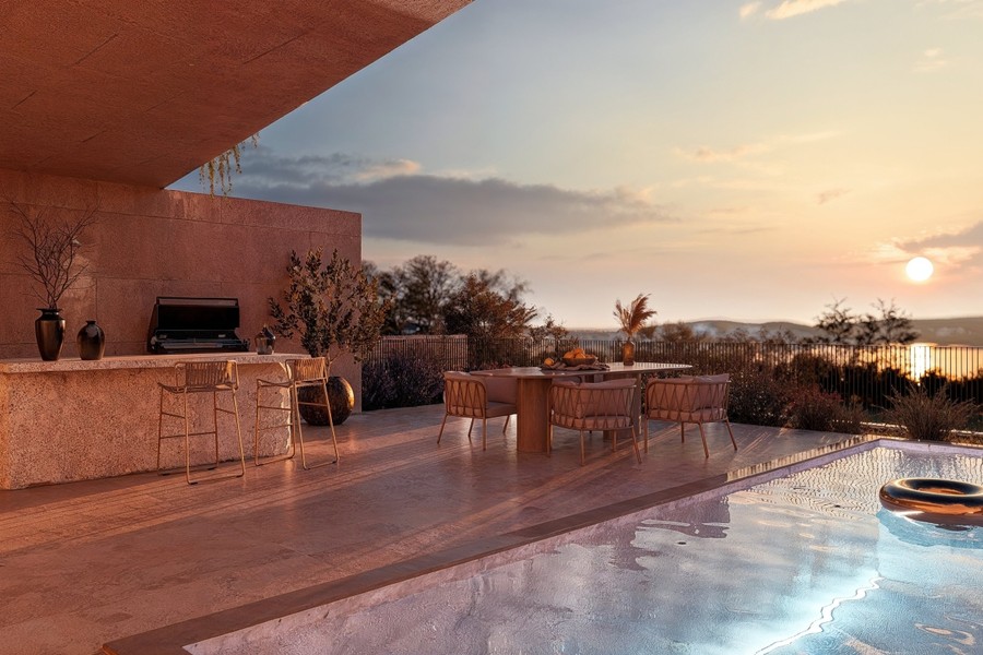 Terrace with outdoor kitchen at sunset
