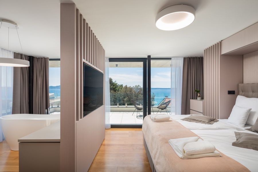 Bedroom with double bed and view of the sea