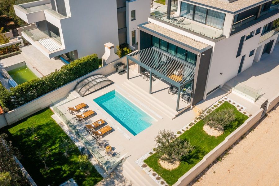 Aerial view of the villa with pool and garden