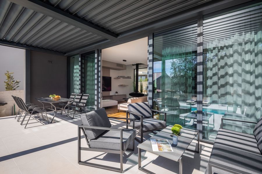 Terrace under the pergola with lounge
