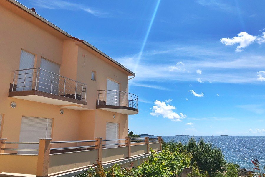 House with balconies above the sea