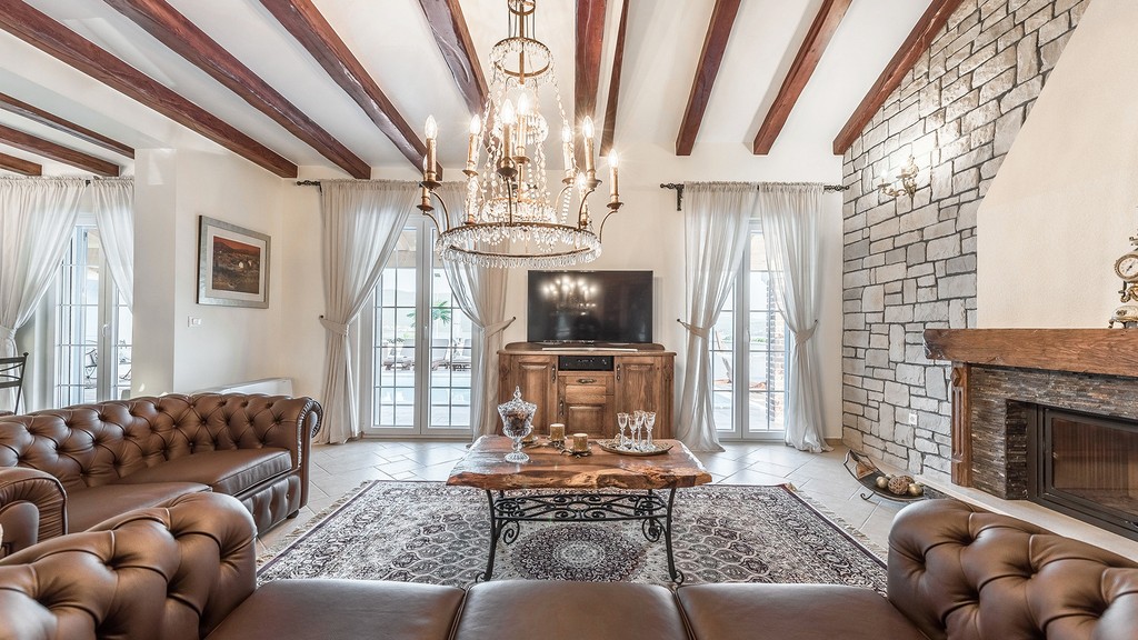 Living room with wooden beams and chandelier
