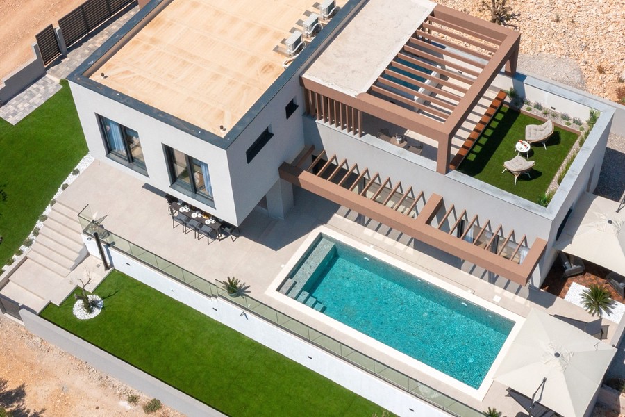 Aerial view of the villa with pool and roof terrace