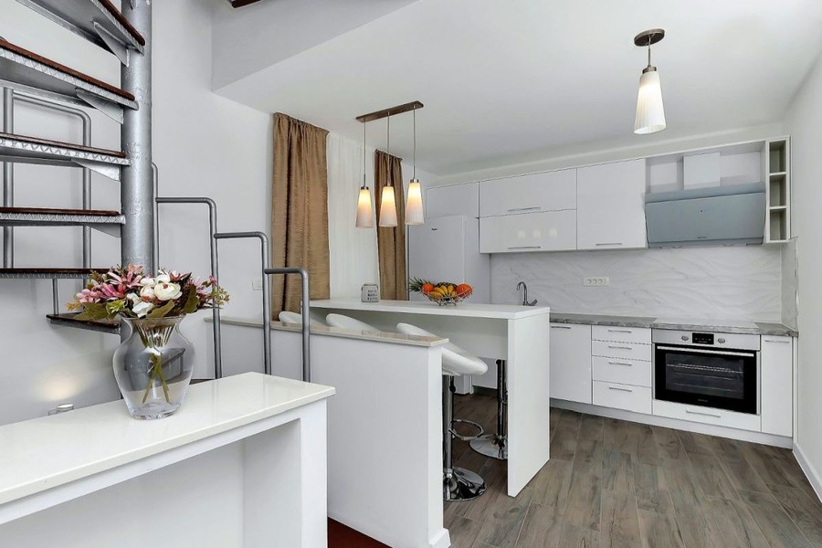 Kitchen with counter and spiral staircase