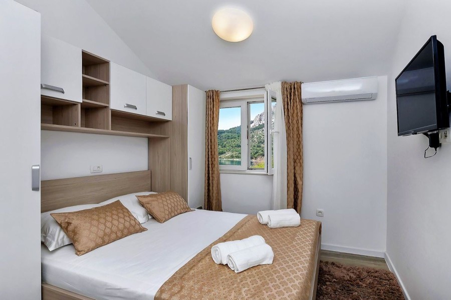 Bedroom with double bed and television