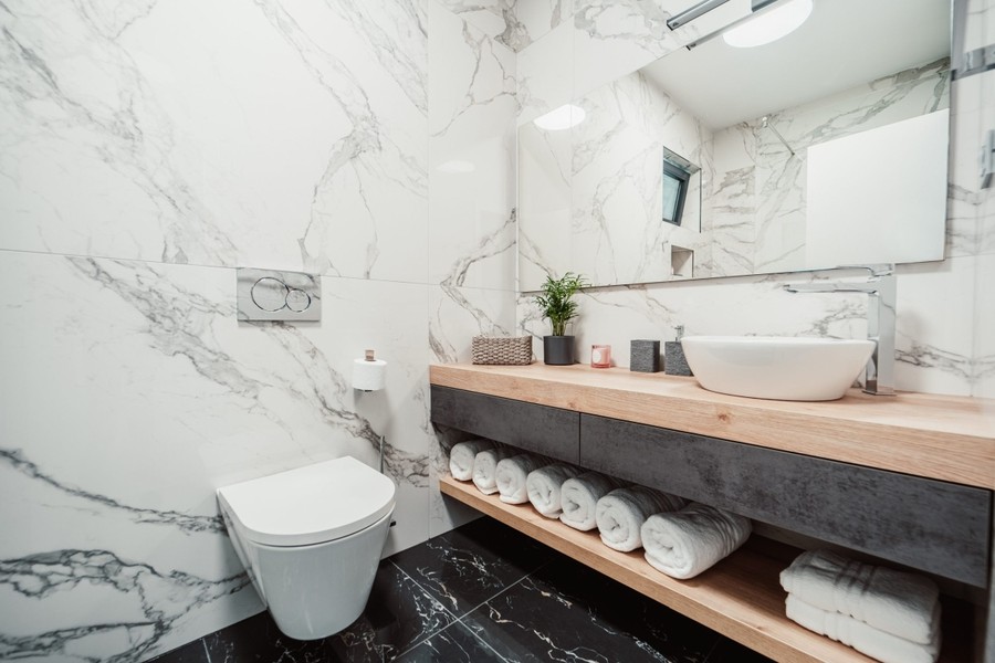 Bathroom with wooden washbasin