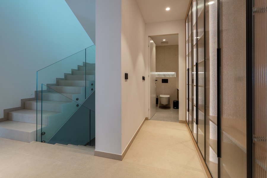 Hallway with glass staircase