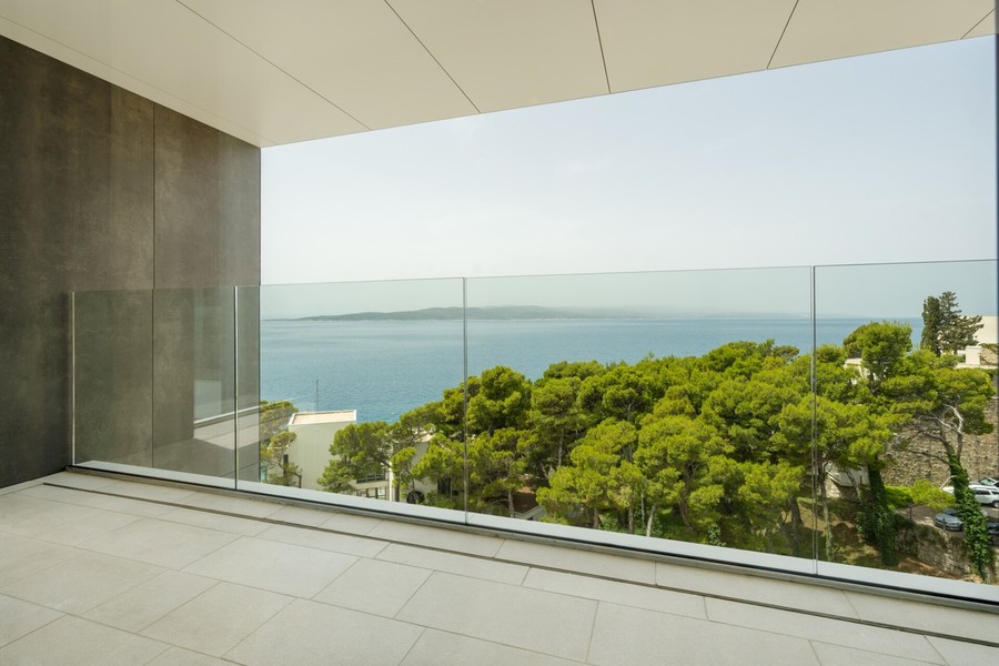 Balcony with glass balustrade and sea view