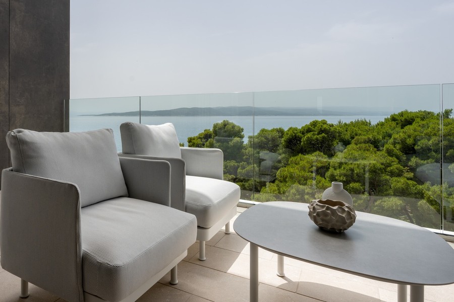 Terrace with armchairs and view of the sea