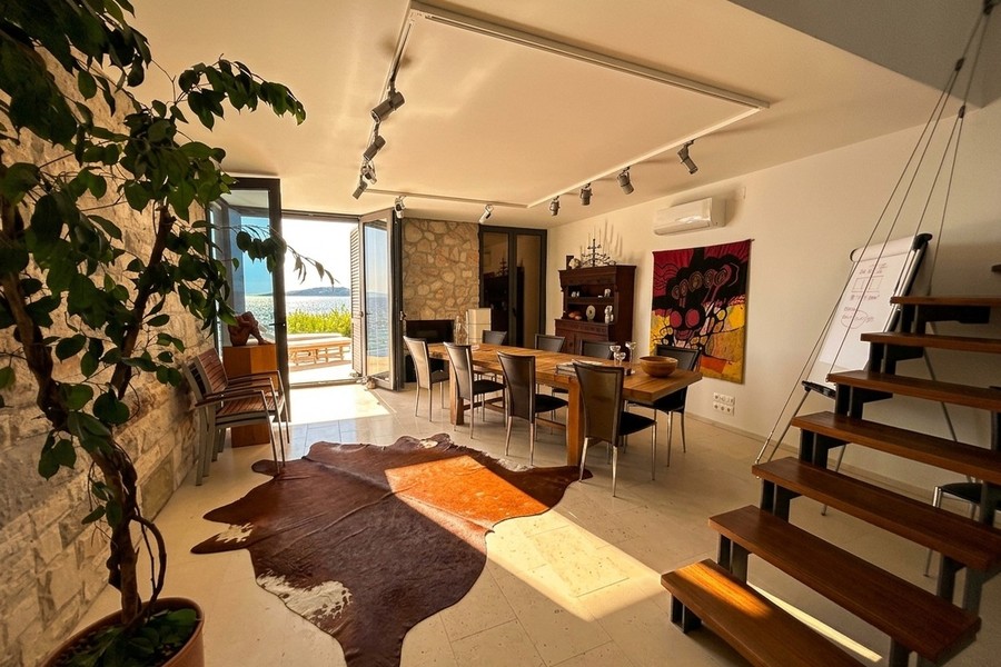 Living area with wooden staircase
