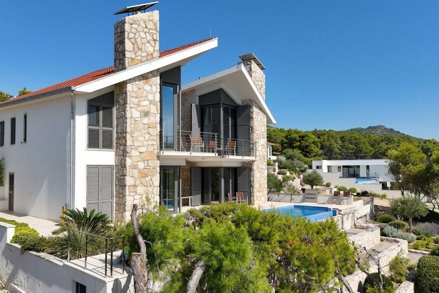 Villa with natural stone fireplace and balconies