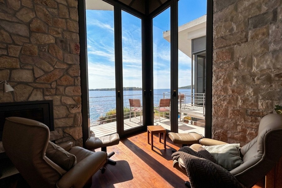 Living room with fireplace and sea view