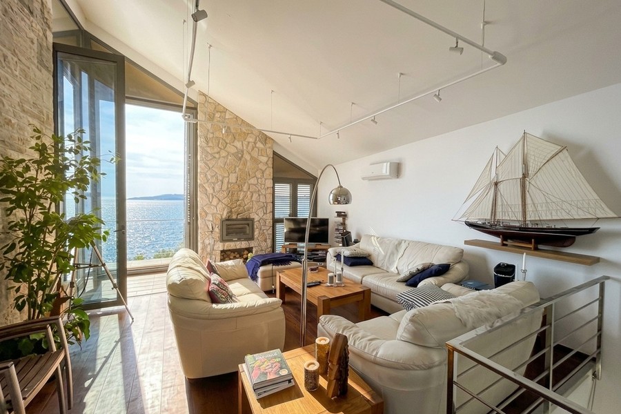 Living room with sailing ship model and sea view