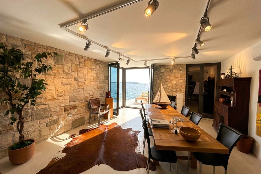 Dining area with natural stone wall