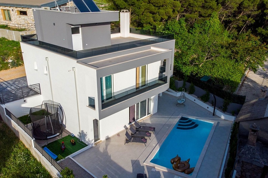 Aerial view of the villa with pool and garden