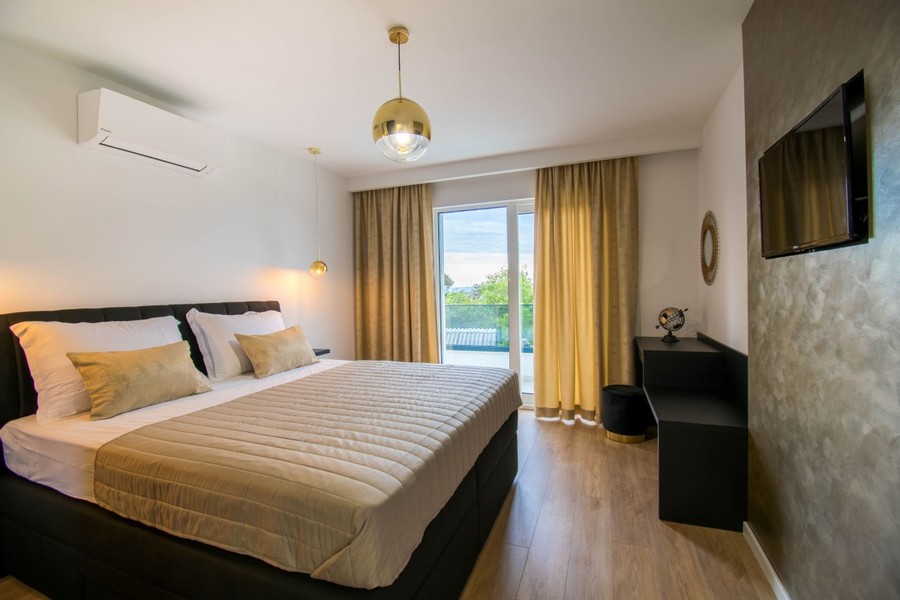 Bedroom with double bed and balcony door