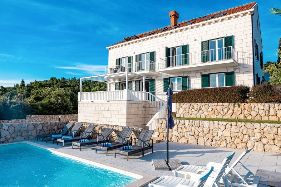 Stone villa with pool and sun loungers