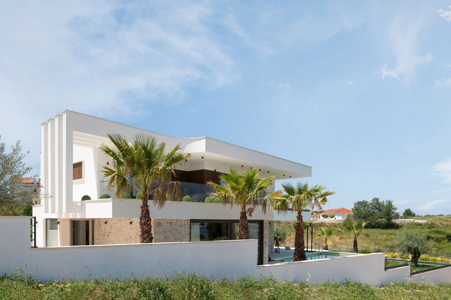 Villa with palm trees and pool