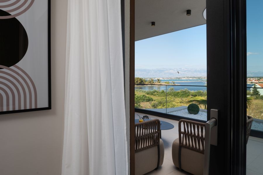 Terrace with armchairs and view of the sea
