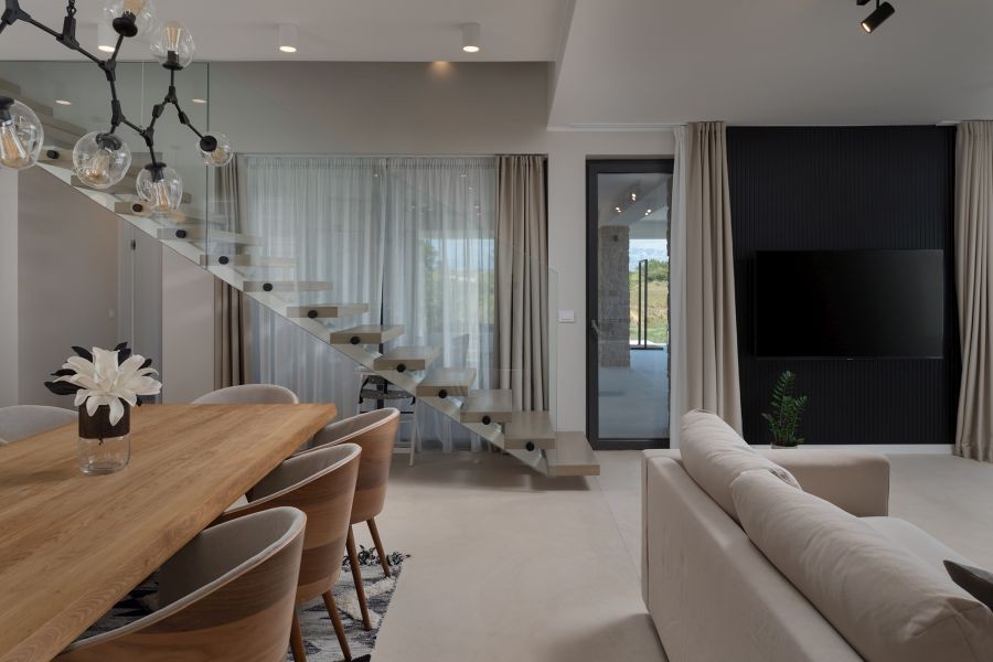 Dining area with glass staircase