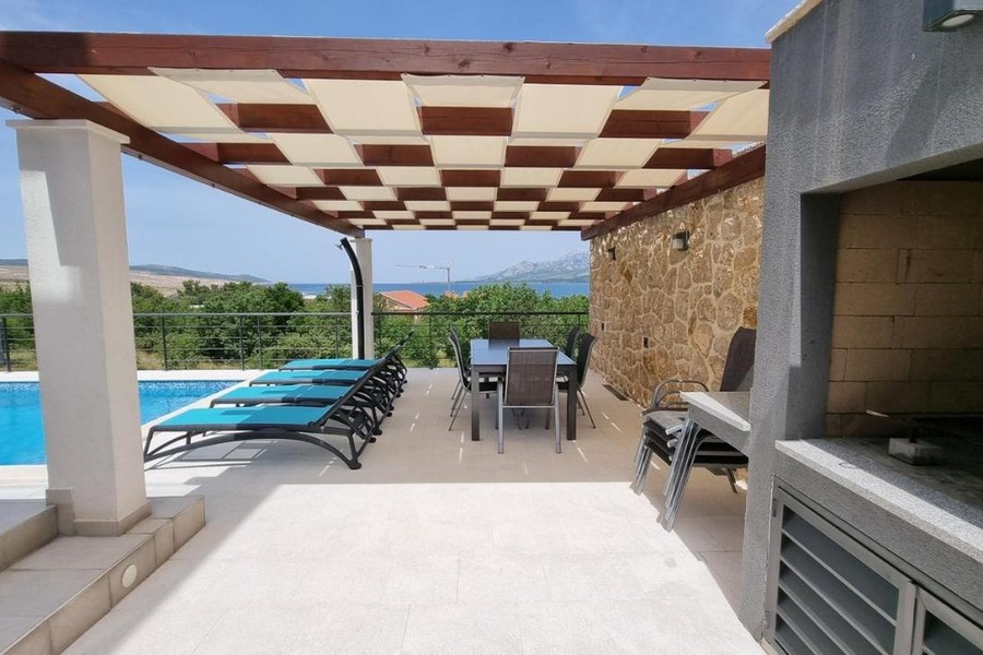 Terrace with grill and view of the pool