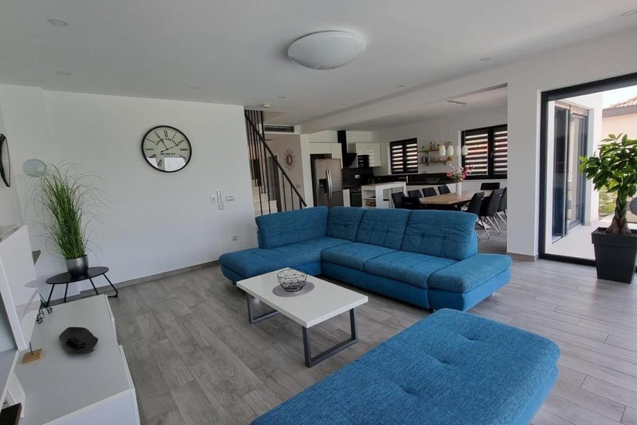 Living room with blue corner sofa