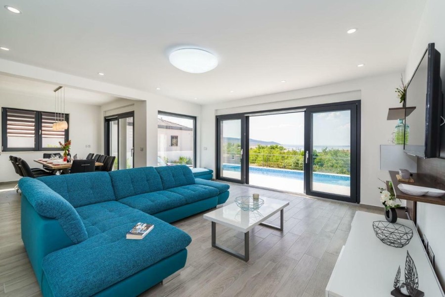 Living room with glass front facing the pool