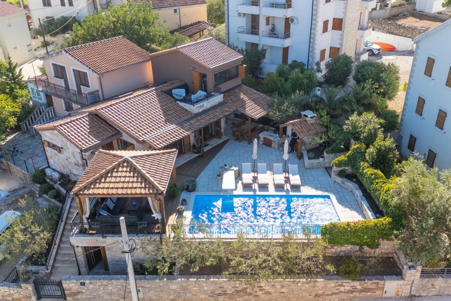 Stone house with pool and gazebo from above